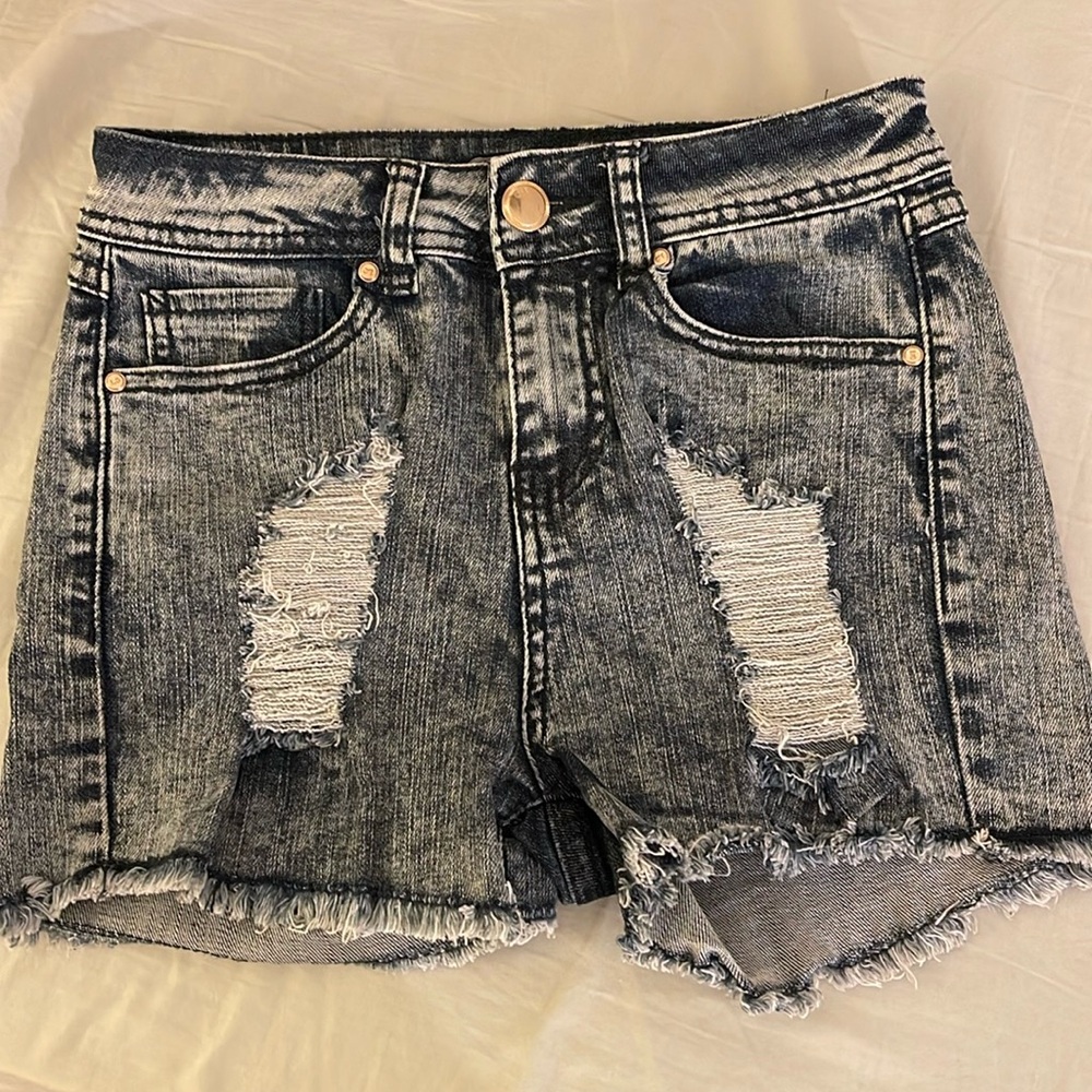 3/$15. Small ripped woman’s shorts
